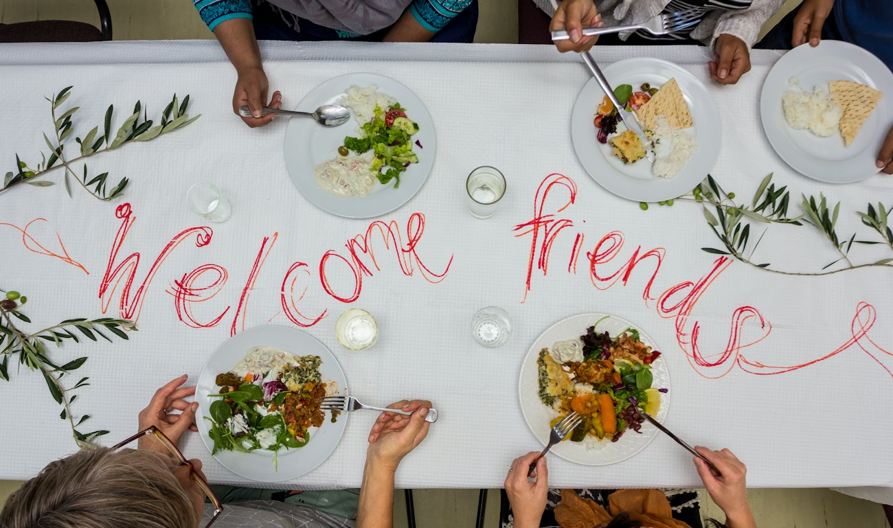 Colleagues sharing lunch around a long table